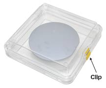 plastic membrane box holding silicon wafer